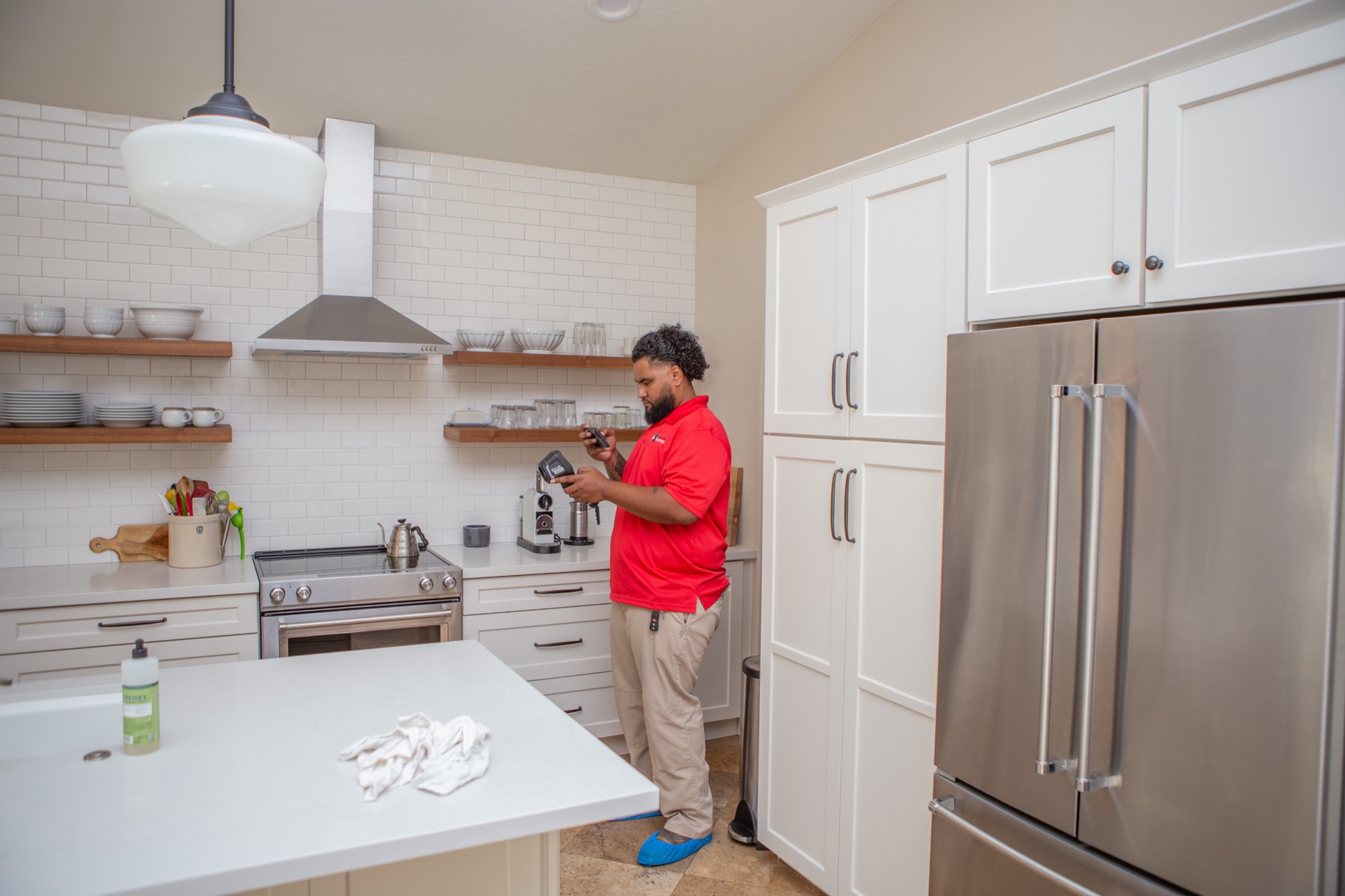 Technician assessing hidden moisture inside a home